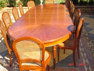 Restored extension dinning table & chairs long view after